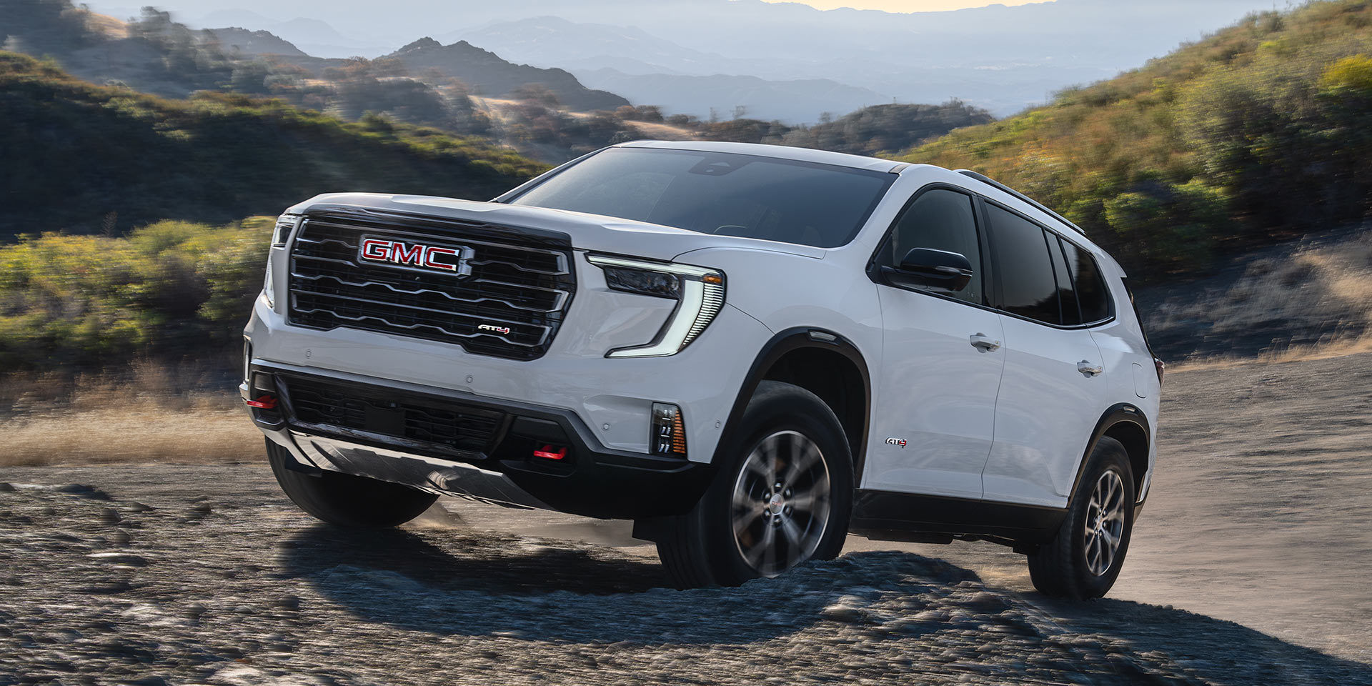 Front Three-Quarters View of the GMC Acadia AT4 Mid-Size Off-Road SUV Parked on a Beach
