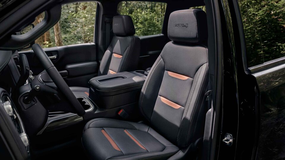 Interior view with driver and front passenger seat in a 2022 GMC Sierra AT4 truck