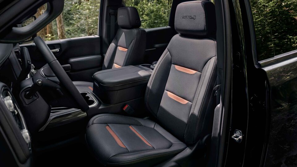 Interior view with driver and front passenger seat in a 2022 GMC Sierra AT4 truck