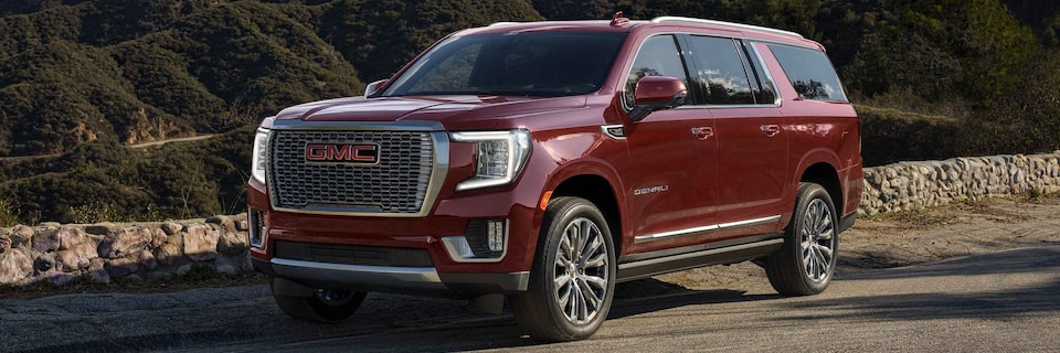 2021 GMC Acadia SUV driving on two-lane road