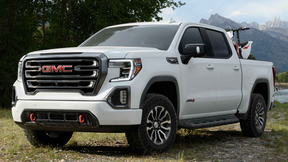 2021 GMC Sierra AT4 Diesel parked in front of Mountain