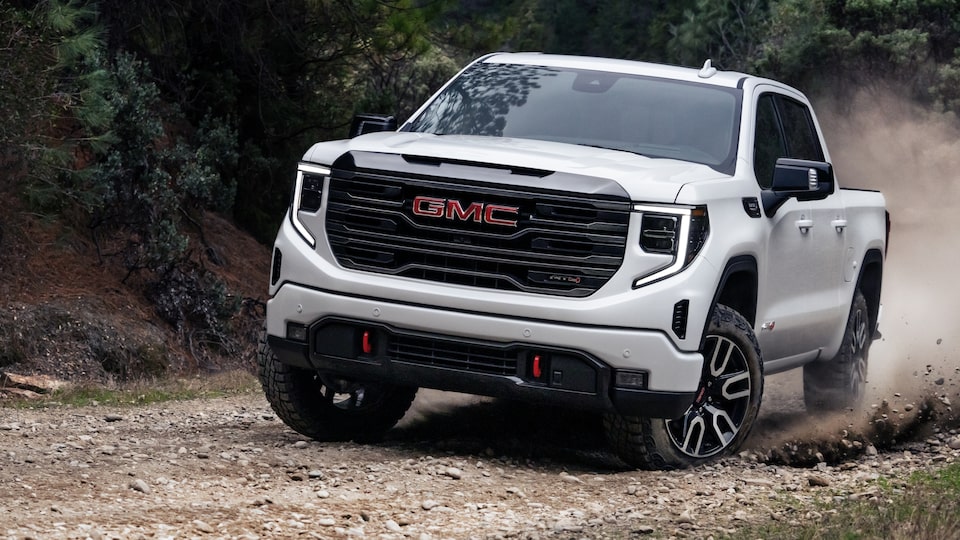 2022 GMC Sierra AT4 Diesel parked in front of Mountain