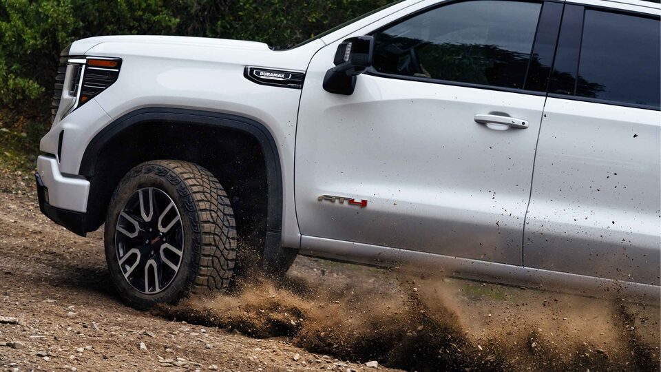 2023 GMC Sierra AT4 Diesel driving on dirt mountain side