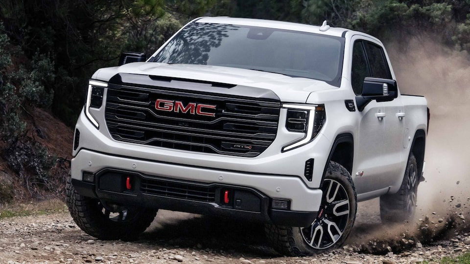 2023 GMC Sierra AT4 Diesel parked in front of Mountain