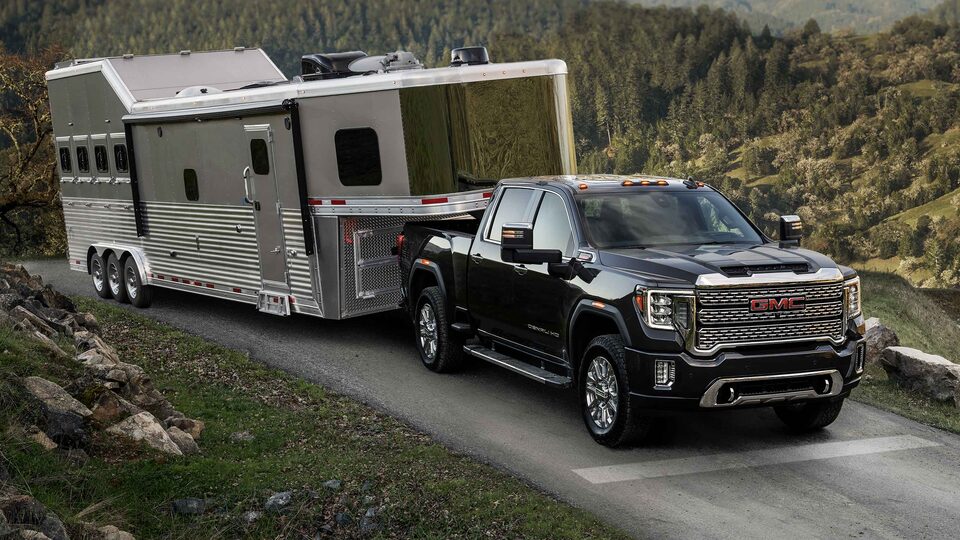 2023 GMC Sierra HD Diesel pulling Camper on Mountainside