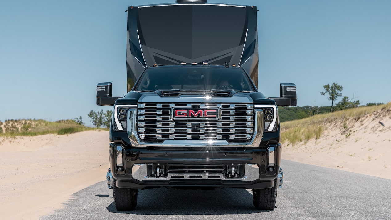 2026 GMC Sierra HD Diesel pulling Camper on Mountainside