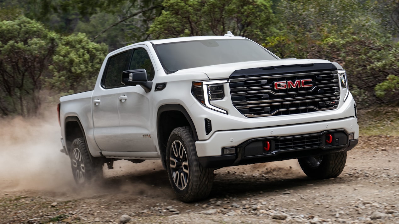 2026 GMC Sierra AT4 Diesel parked in front of Mountain