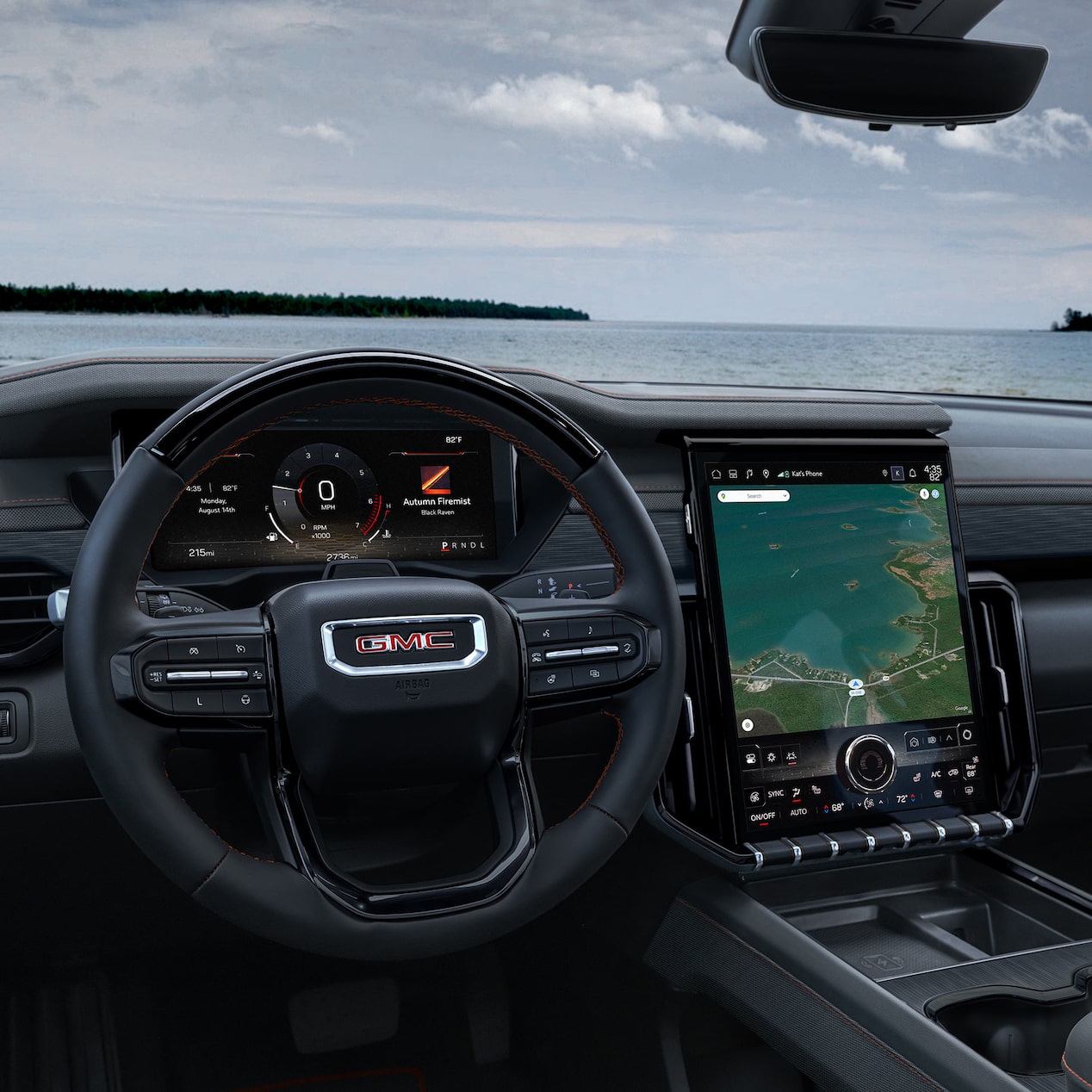 Interior View of the Steering Wheel and Infotainment Screen in the GMC Acadia Mid-Size SUV