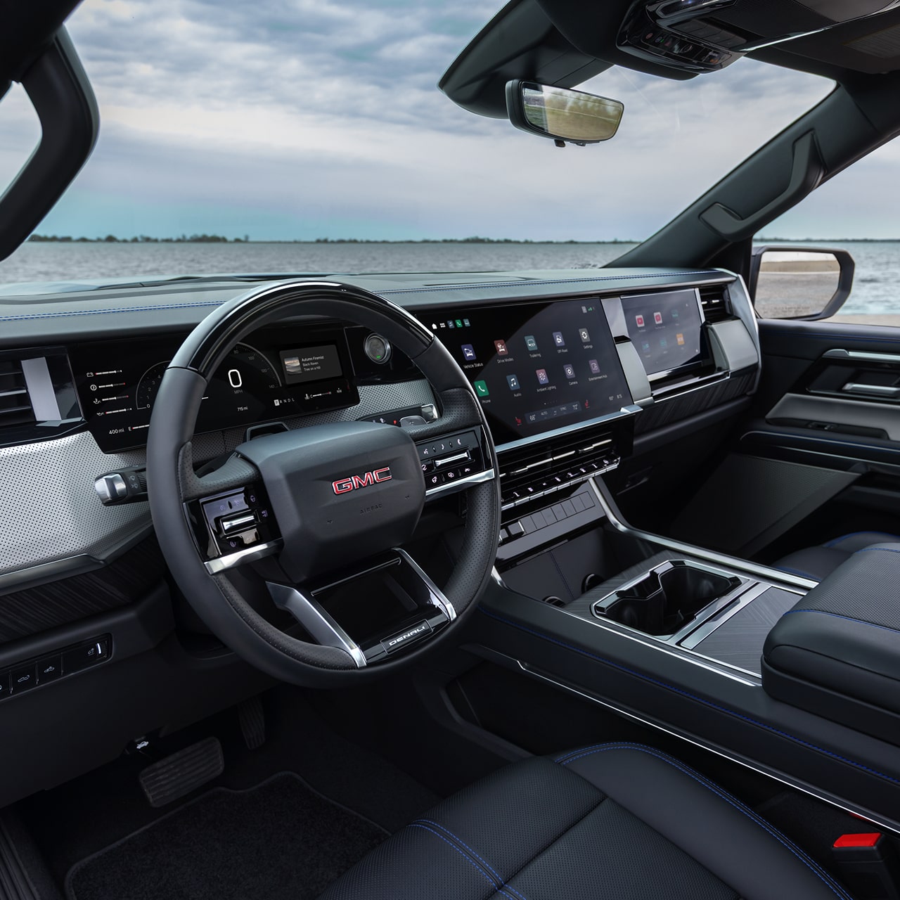 Interior View of the Steering Wheel and Infotainment Screen in the GMC Sierra 1500 Full-Size Truck