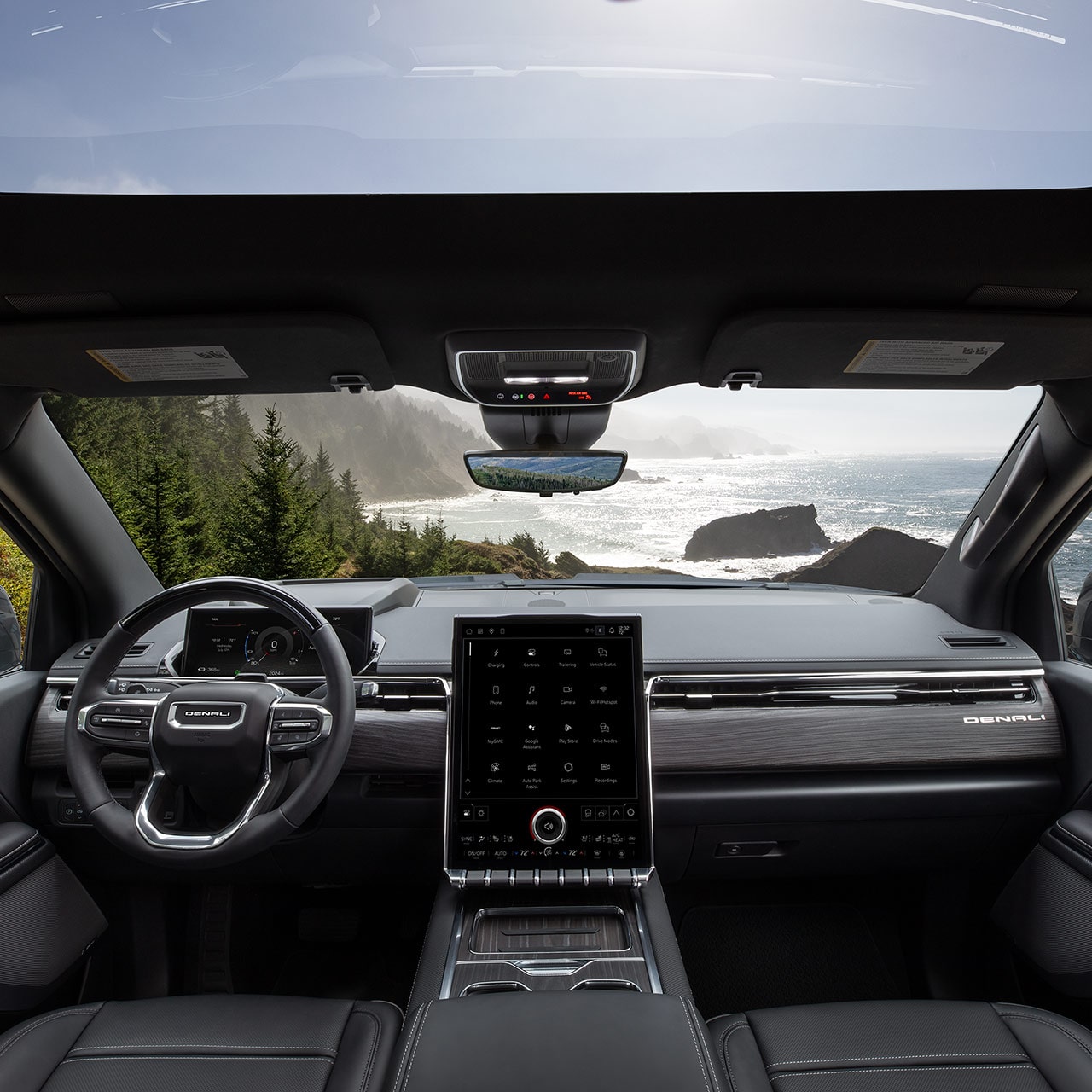 Interior View of the Steering Wheel and Infotainment Screen in the Sierra EV Pickup Truck