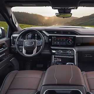 Interior View of the Steering Wheel and Infotainment Screen in the GMC Sierra 1500 Full-Size Truck