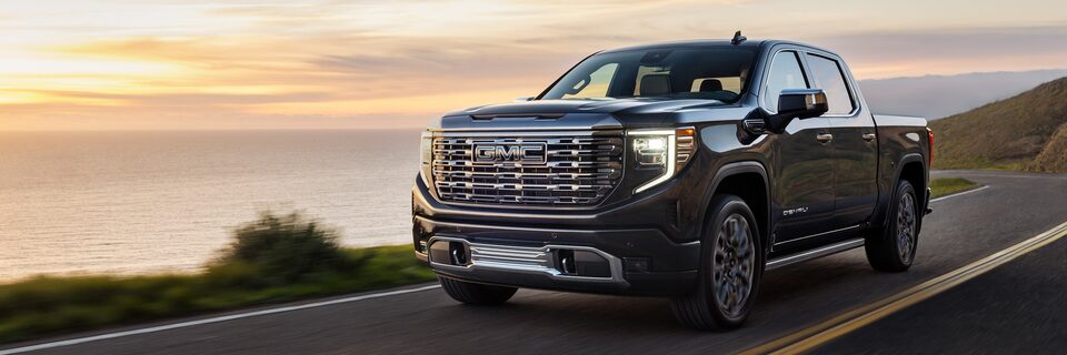 2023 GMC Light Duty Truck driving on mountain side