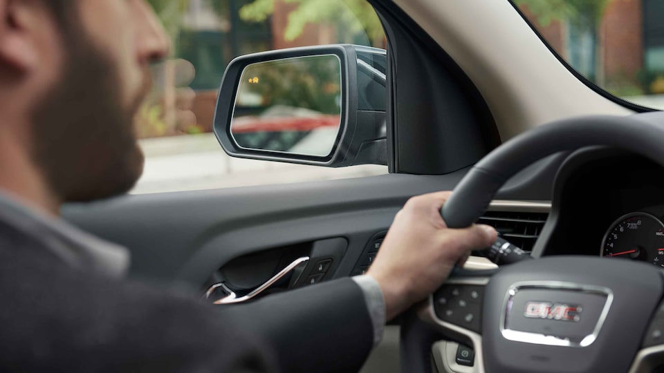 2021 GMC Acadia mid-size SUV with blind spot lights on side mirrors