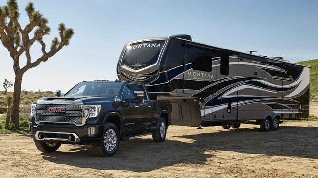 2021 GMC Sierra HD Denali Luxury Heavy Duty Truck parked with trailer