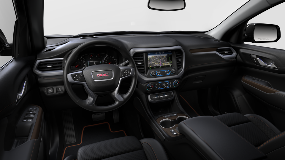 The Jet Black Interior with the Steering Wheel and Infotainment System on the GMC Acadia AT4