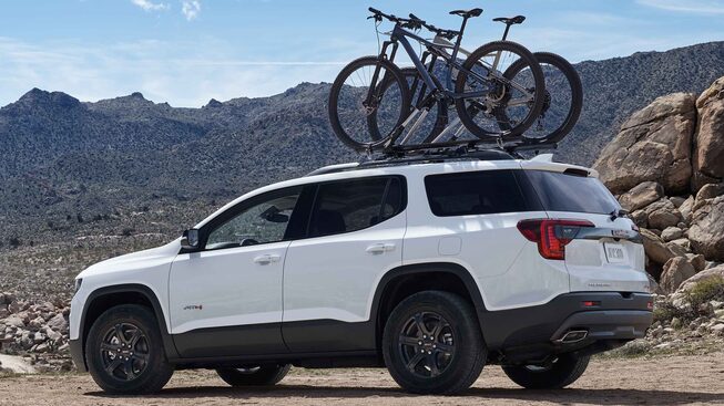 2022 GMC Acadia AT4 Off-road SUV Exterior Side View with Bikes on roof
