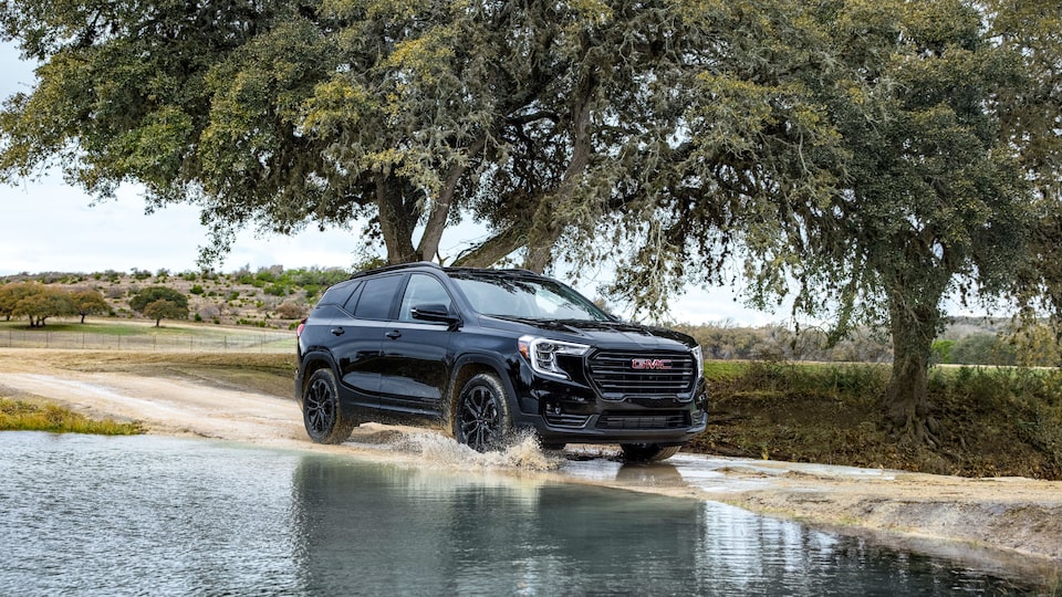 2022 GMC Terrain SLE/SLT Small SUV Driving on Dirt Road - Side View