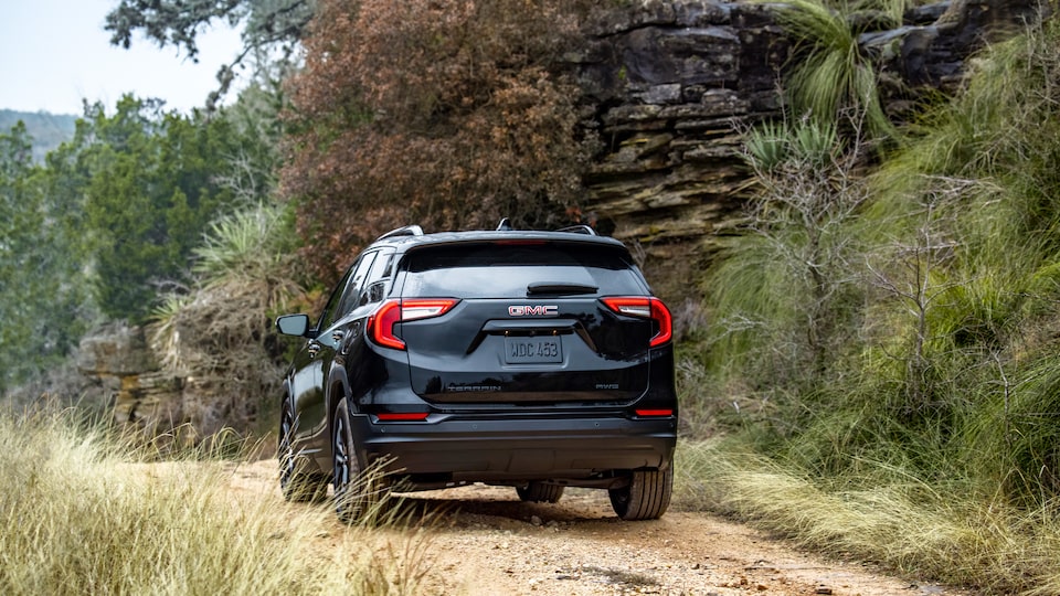 2022 GMC Terrain SLE/SLT Small SUV Driving on Dirt Road - Rear View