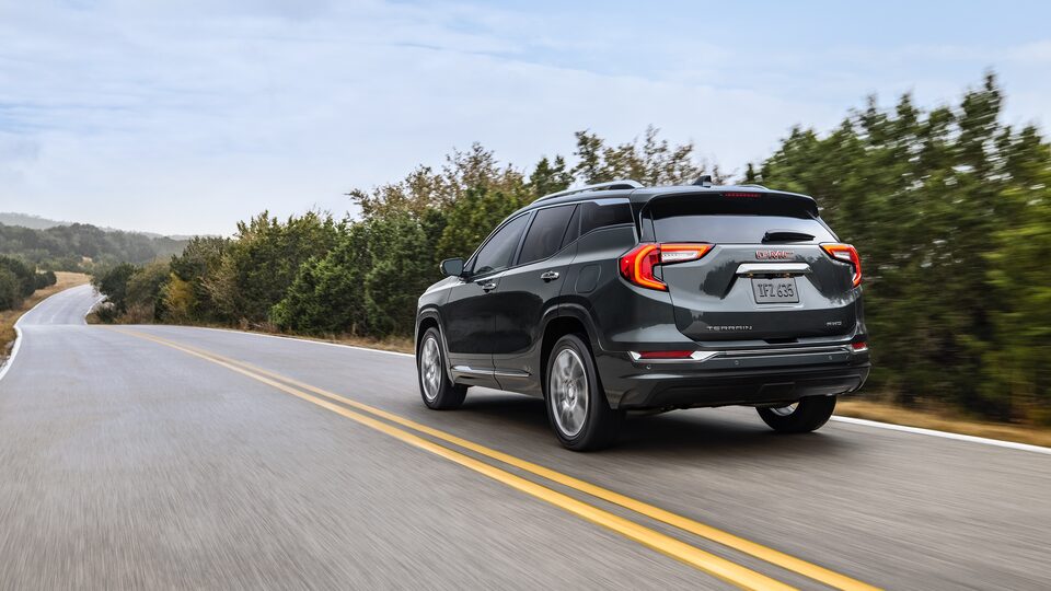 2022 GMC Terrain Denali Small SUV Driving on Road - Rear Side View