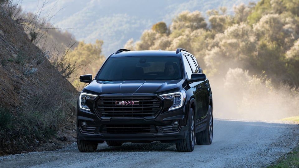 2022 GMC Terrain SLE/SLT Small SUV Driving on Dirt Road - Front View