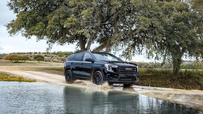2022 GMC Terrain SLE/SLT Small SUV Driving on Dirt Road - Side View