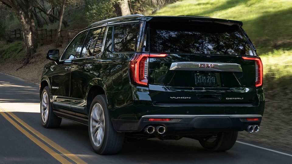 2022 GMC Yukon Denali Driving In Woodsy Area