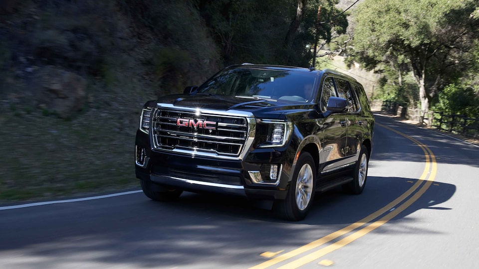 2022 GMC Yukon SLT Full-Size SUV Driving on Road - Front Side View