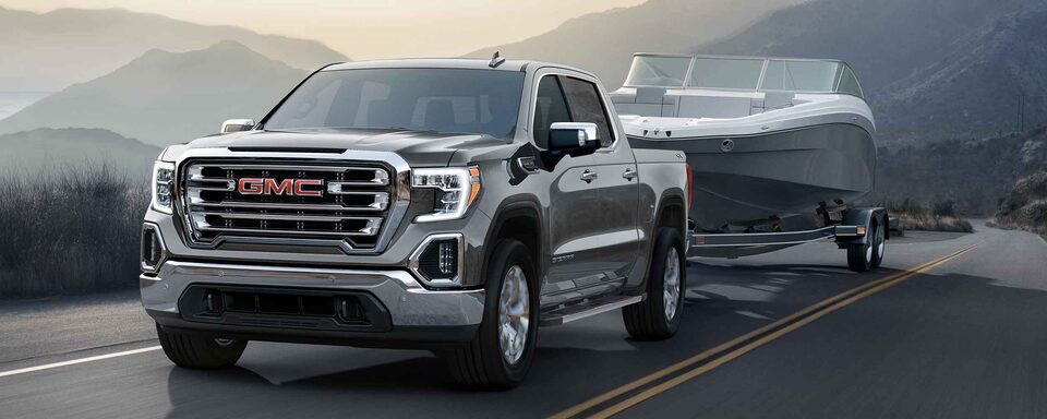 2022 GMC Sierra 1500 SLE Towing a Boat