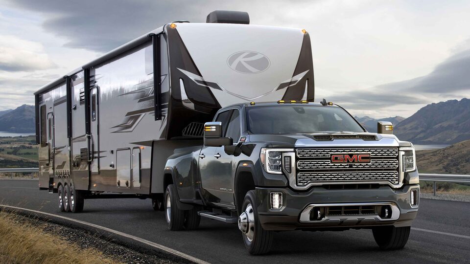 2021 GMC Sierra HD Heavy Duty Truck towing a camper