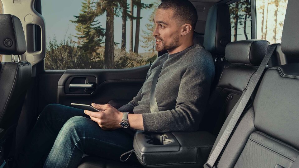 Man Sitting in 2022 GMC Sierra HD Rear Seat