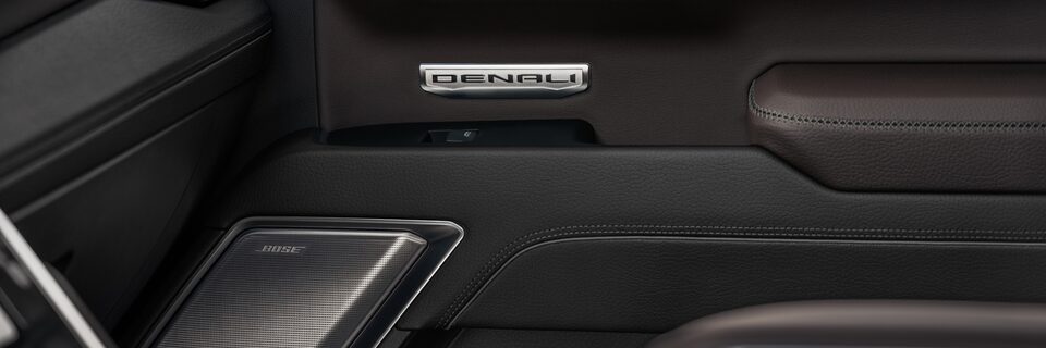 Closeup on Sierra Denali Pickup Truck Door Panel With Bose Speakers and Arm Rest