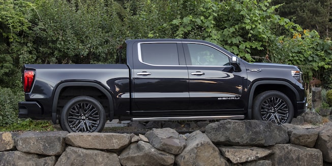 The Pacific Blue Metallic GMC Sierra Denali Off-roading in the Wilderness