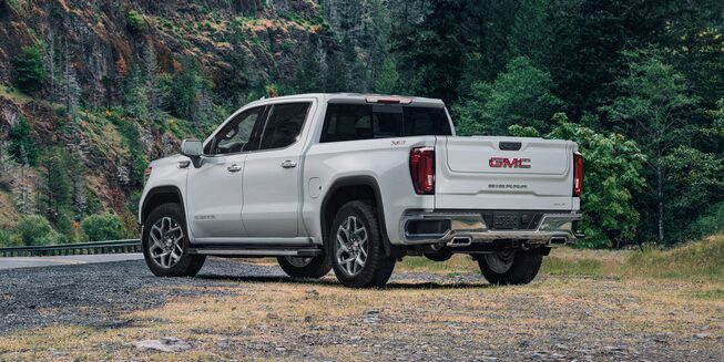 Summit White GMC Sierra Pickup Truck Parked Off-Road