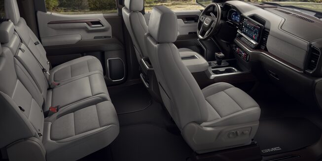 Leather Interior Seating on the GMC Sierra Parked Off-Road With Trees