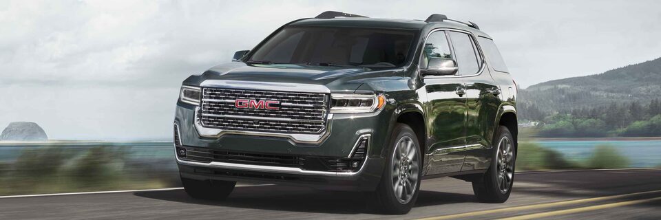 GMC Acadia Driving On-Road With Water and Hills