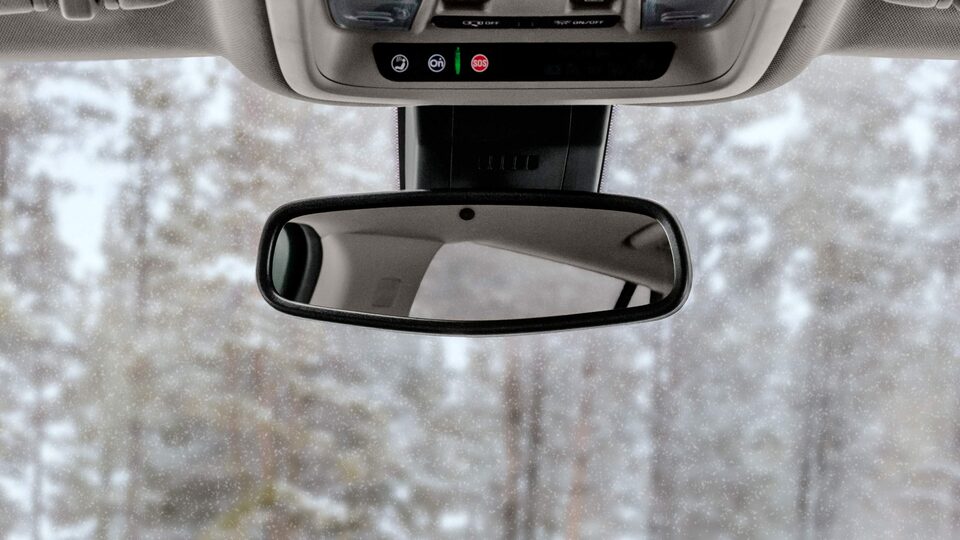 Red GMC Terrain SLT Driving Off-Road With Grass and Trees