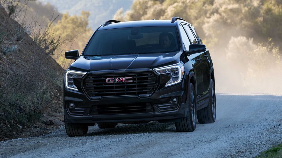 Ebony Twilight Metallic GMC Terrain SLT Driving Off-Road Kicking Up Dirt