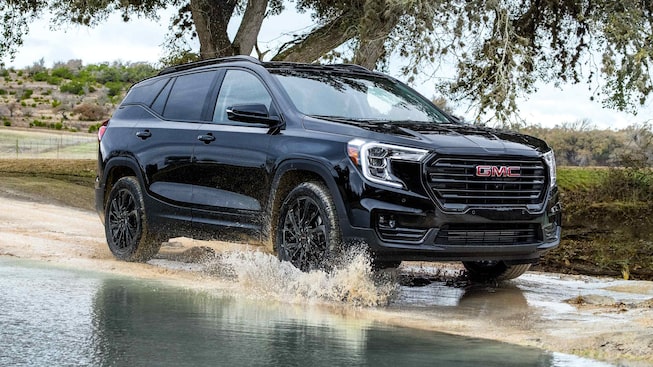 Marine Metallic GMC Terrain SLT Driving Off-Road through Water and Mud
