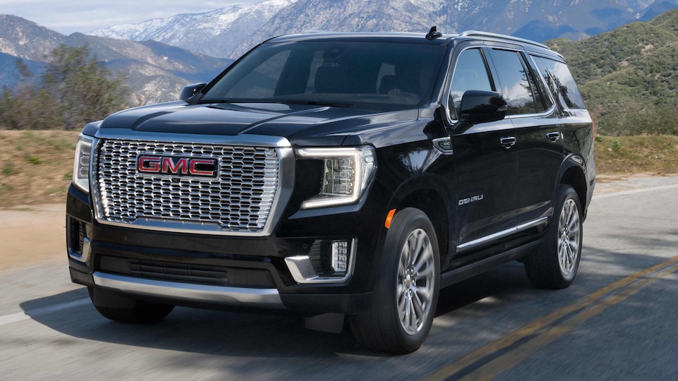The Onyx Black GMC Yukon Driving On an Open Scenic Mountain Road 