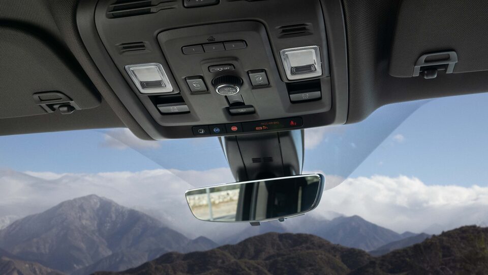 Closeup on the Rearview Mirror and OnStar and Connected Services Button on the GMC Yukon