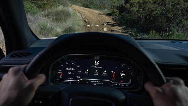 A Person Driving the GMC Yukon AT4 Off-Road with the Heads-Up Display