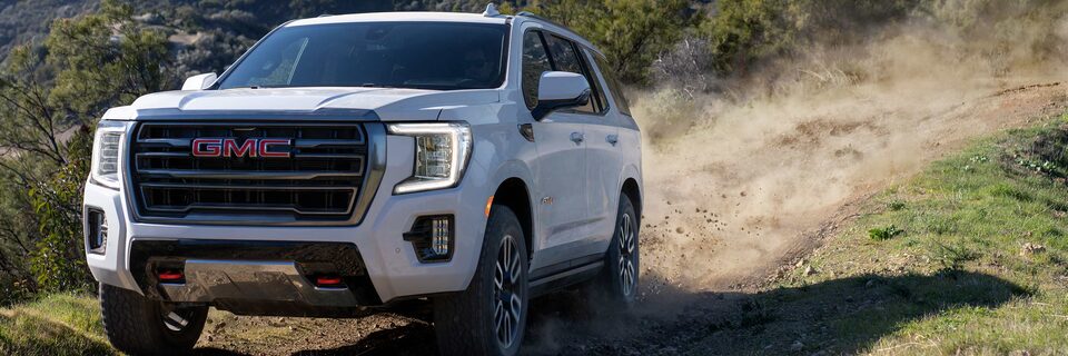 The Summit White Yukon SUV Off-Roading 