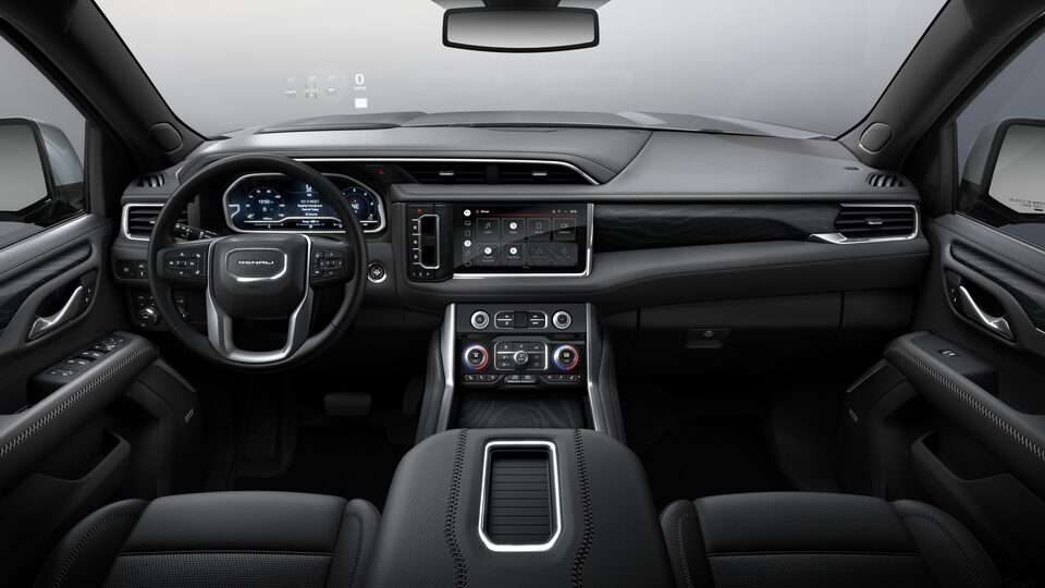A Rear Passengers View of the Front Jet Black Interior of the GMC Yukon Denali