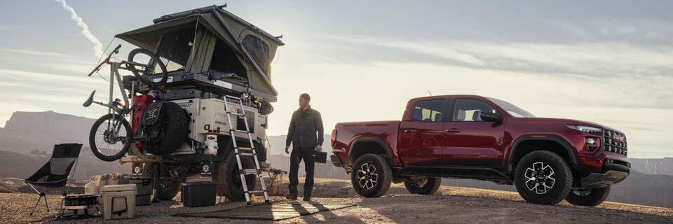 A Man Parks His Canyon AT4X Next to His Pop Up Tent in the Desert