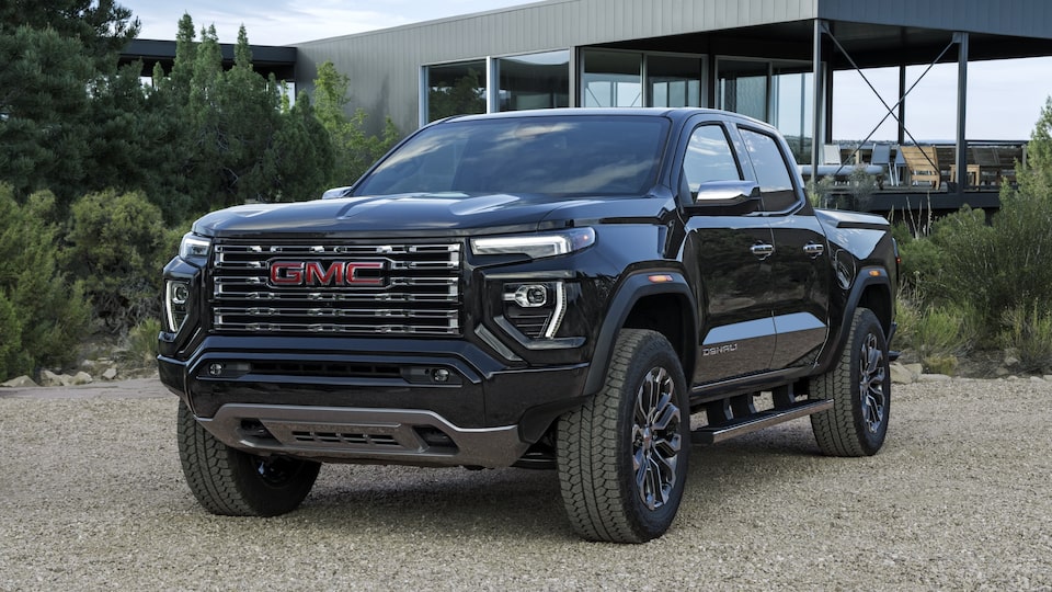 The Canyon Denali Parked Outside a Modern Luxurious Home