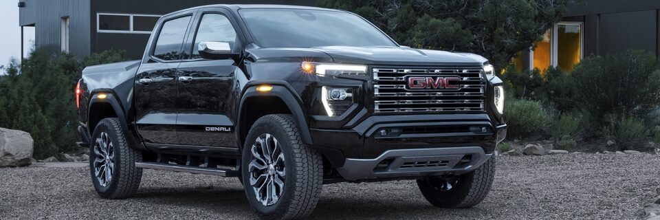 The Canyon Denali Parked Outside a Modern Luxurious Home