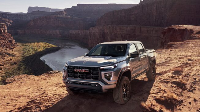 The GMC Canyon Elevation Parked Off-Road Near A Cliff and Water