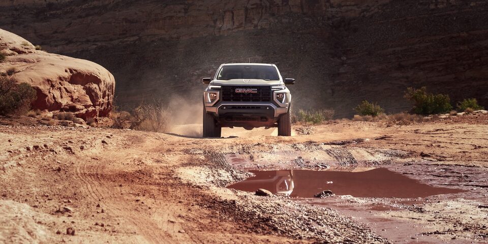 The GMC Canyon Elevation Driving Off Road Through Dirt in a Desert