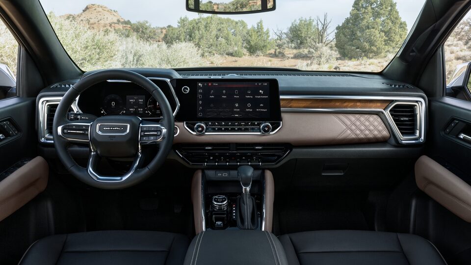 The GMC Canyon Denali Front Interior with the Steering Wheel and Infotainment