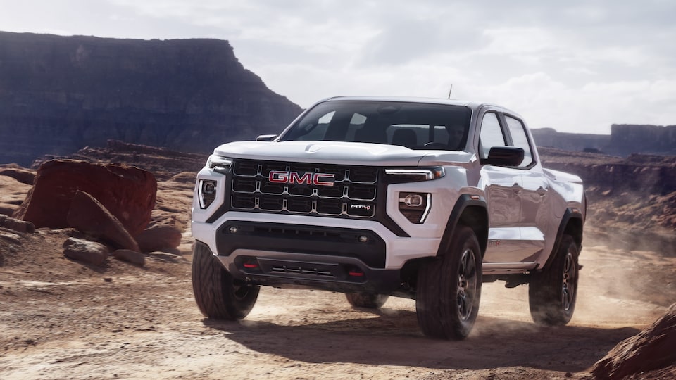 The GMC Canyon AT4 Driving Off-Road Kicking up Dirt